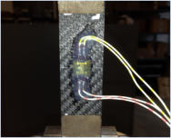 Biaxial strain gage glued on a tensile test specimen